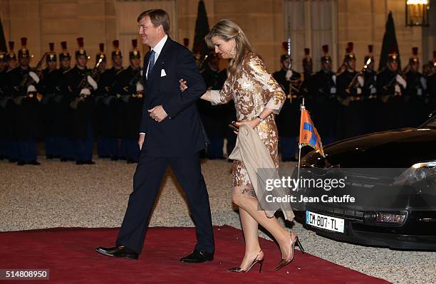 King Willem-Alexander of the Netherlands and Queen Maxima of The Netherlands arrive to the State Dinner in their honor at Elysee Palace on March 10,...