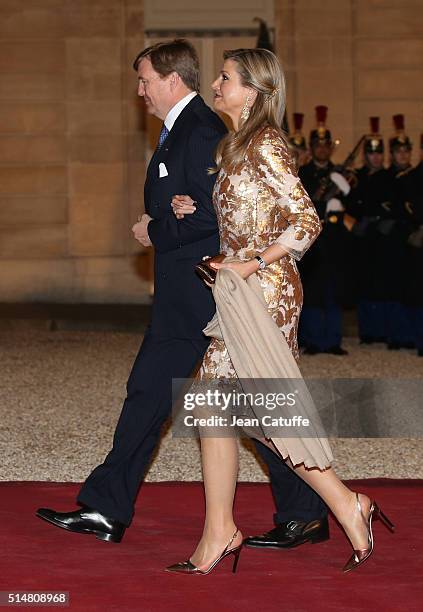 King Willem-Alexander of the Netherlands and Queen Maxima of The Netherlands arrive to the State Dinner in their honor at Elysee Palace on March 10,...