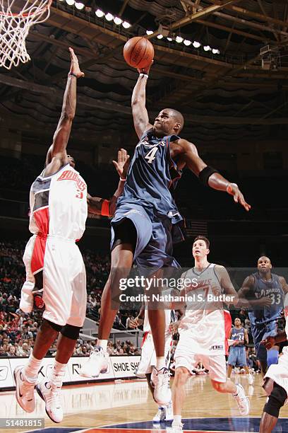 Antawn Jamison of the Washington Wizards goes to the basket against the Charlotte Bobcats on October 14, 2004 at Charlotte Coliseum in Charlotte,...