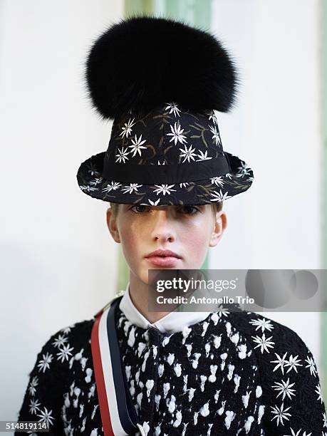 Model prepares backstage before the Moncler Gamma Rouge show as part of the Paris Fashion Week Womenswear Fall/Winter 2016/2017 on March 9, 2016 in...