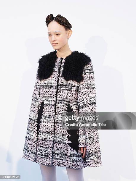 Model prepares backstage before the Moncler Gamma Rouge show as part of the Paris Fashion Week Womenswear Fall/Winter 2016/2017 on March 9, 2016 in...
