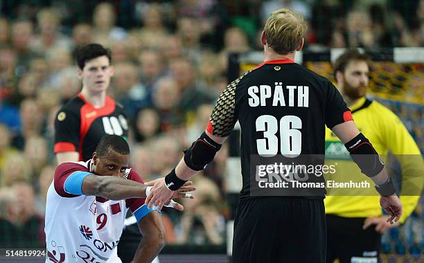 Manuel Spaeth of Germany shakes the hand with Rafael Capote of Qatar during a international friendly handball match between Germany and Qatar on...