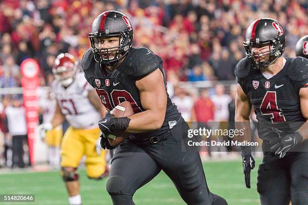 Solomon Thomas of the Stanford Cardinal runs back a fumble during the Pac-12 Championship Game against the USC Trojans played on December 5, 2015 at...