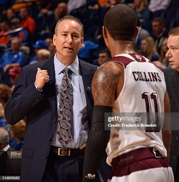 Head coach Billy Kennedy coaches Anthony Collins of the Texas A&M Aggies during the first half of an SEC Tournament Quarterfinal game against Florida...