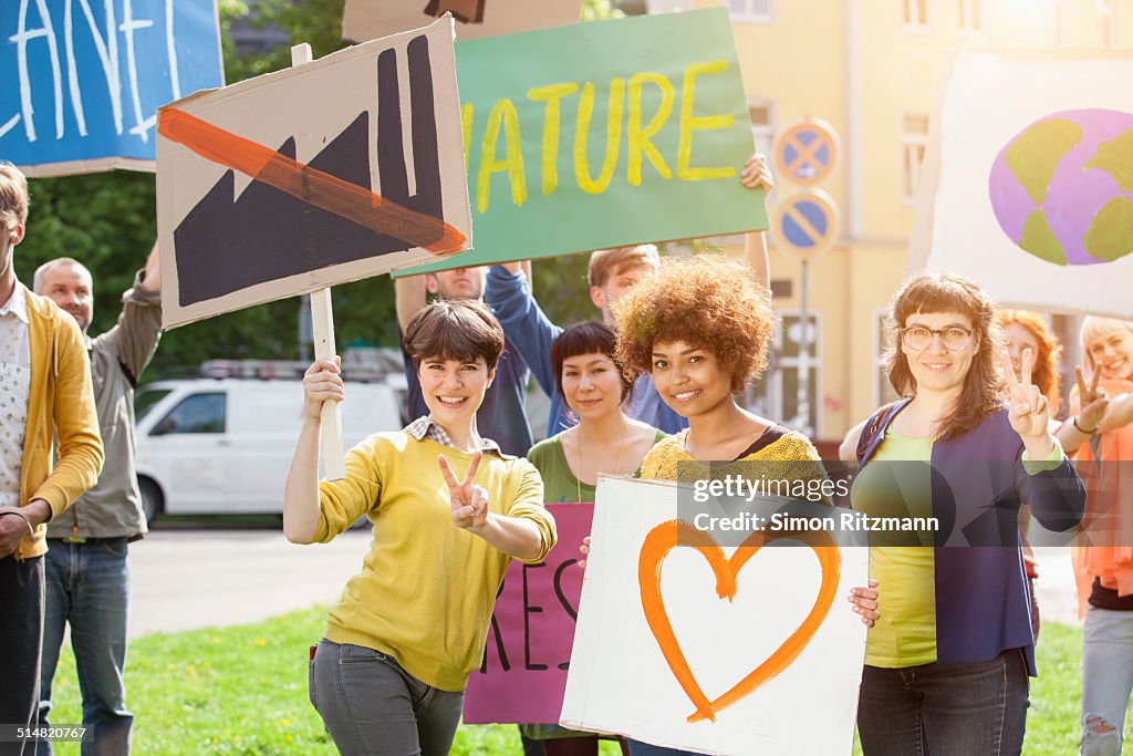 Group of young people demonstrating with banners