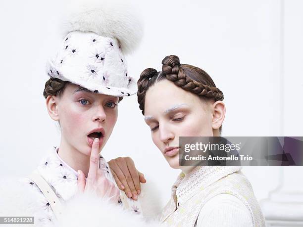 Models prepares backstage before the Moncler Gamma Rouge show as part of the Paris Fashion Week Womenswear Fall/Winter 2016/2017 on March 9, 2016 in...