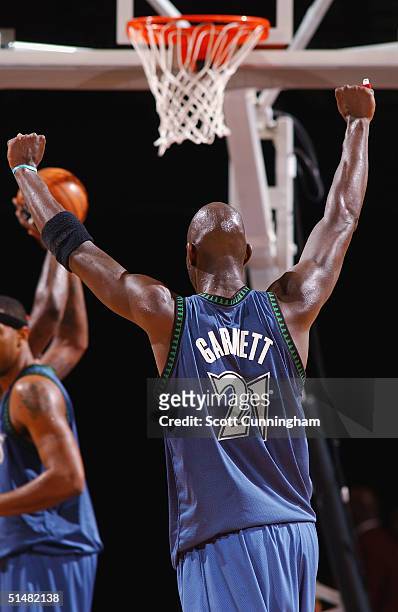 Kevin Garnett of the Minnesota Timberwolves celebrates after making a first period buzzer beater against the Atlanta Hawks during a game on October...