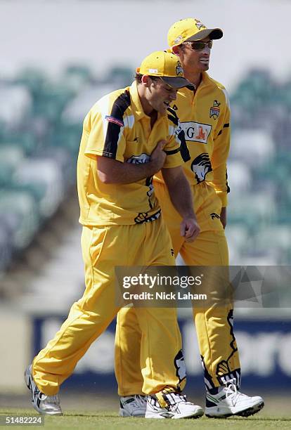 Scott Meuleman of the Warriors is helped from the ground after dislocating his shoulder during the ING CUP match between the Western Warriors and the...