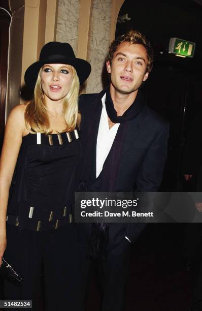 Actors Sienna Miller and Jude Law attend the party following the World Premiere of "Alfie", at Koko, Camden on October 14, 2004 in London.