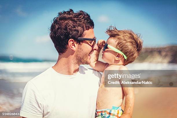 father and son - baby sunglasses stock pictures, royalty-free photos & images