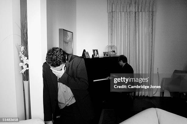 Actor Andrew Lincoln who has starred in shows "This Life" and "Teachers" with fellow actor Bill Nighy in the background on the piano pose during a...