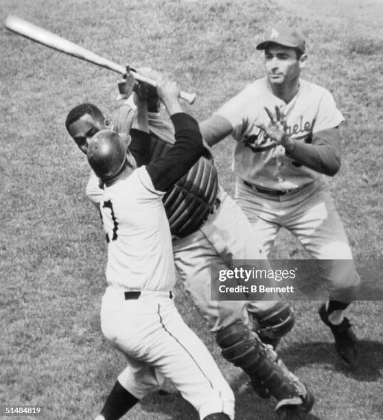 Pitcher Juan Marichal of the San Francisco Giants hits catcher John Roseboro of the Los Angeles Dodgers over the head with his bat as the two scuffle...