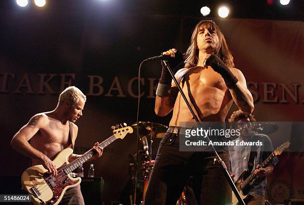 Flea, Anthony Kiedis and John Frusciante of The Red Hot Chili Peppers perform at a Democratic Senate fundraising concert on October 15, 2004 at...