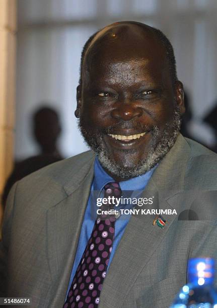 Sudan's main rebel group leader John Garang reacts to questions from journalists 16 October 2004 during a press conference in Nairobi, at which an...