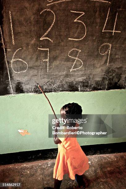 small child in primary school - sudanese girls stock pictures, royalty-free photos & images