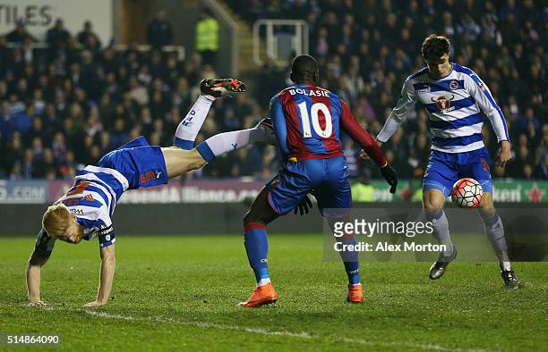 Yannick Bolasie of Crystal Palace battles with Paul McShane and Jake Cooper of Reading during the Emirates FA Cup sixth round match between Reading...