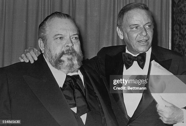 Hollywood, CA:Orson Welles and Frank Sinatra stop for the cameras shortly before Sinatra hosted a dinner where Welles became the third film...