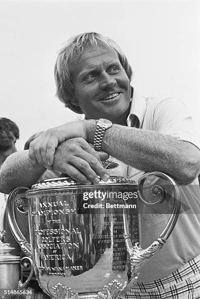 Jack Nicklaus holds the trophy after winning his fourth PGA title at the Firestone Country Club in Akron Ohio on August 10, 1975.