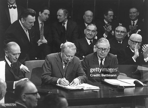 British Prime Minister Edward Heath signs the treaty bringing the U.K. Into the European Community. A protester named karen Cooper threw ink on...