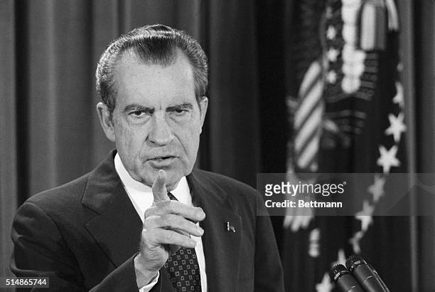 President Nixon points to a reporter during his televised news conference in the East Room of the White House.