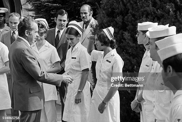 President Nixon greets nurses who attended to him as he was released from Bethesda Naval Hospital where he spent eight days recovering from Viral...