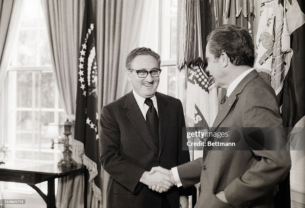 Kissinger And Nixon Shake Hands