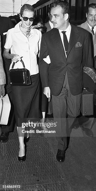 Paris, France: Princess Grace, the former Grace Kelly, and her husband, Prince Rainier, of Monaco walk along platform from train after they arrived...