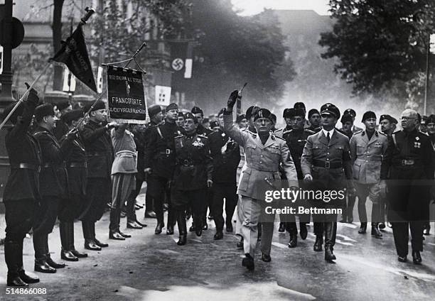 Mussolini in Berlin, marching down Victoriastrasse. Rudolf Hess at his left. Undated photograph.