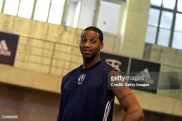 Tracy McGrady of the Houston Rockets observes students in a gymnasium October 16, 2004 in Beijing, China.