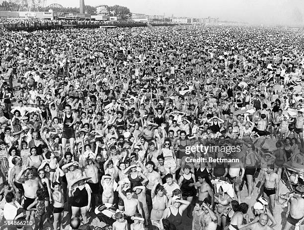 Enormous crowd of people on the beach at Coney Island. Photograph, 1940's.