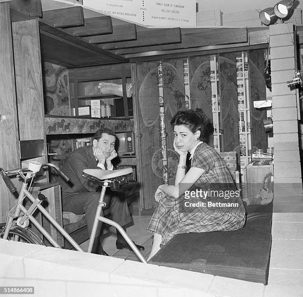 Elise Paul and Tom Wilson sit in family fallout shelter designed as an all-purpose room for the family by the National Design Center in New York.