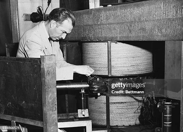 Professor P. Gerald Kruger of the University of Illinois shown with the 1 000 volt cyclotron. Dr. Shields Warren, head of the Atomic Energy...