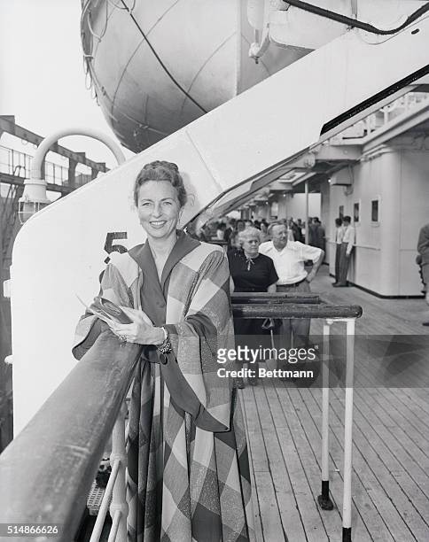 Smiling portrait of American actress Agnes Moorehead on cruise ship.