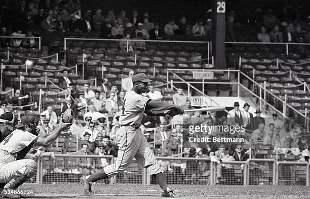 Chicago Cubs shortstop Ernie Banks swings at a pitch during a game against the New York Mets at the Polo Grounds in New York. May 16, 1962.