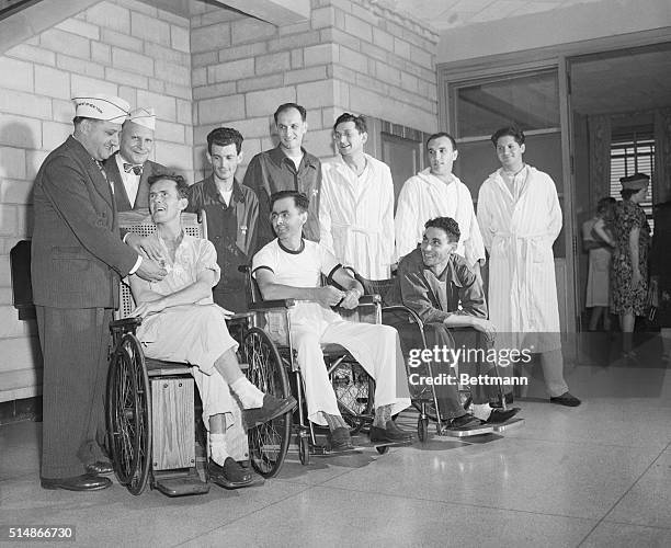 Manhattan Beach Vet. Admin. Hospital: A group of patients at the Manhattan Beach Veterans Admin. Hospital are pictured recieving their W.W.II Victory...