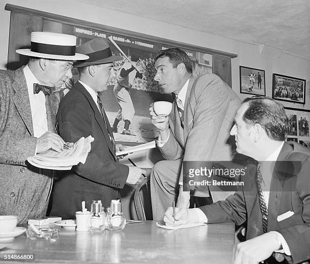 New York, NY: Joe Dimaggio, retired Yankee slugger, taks to newsmen in the Press Room at Yankee Stadium in a pre-game discussion, May 29. Earlier in...