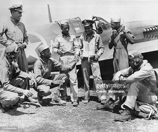 Pilots from the all-black fighter squadron share stories after a raid. The pilots are : Lt. Herbert Clark, Lt. Robert Roberts, Lt. Willie Fuller, Lt....