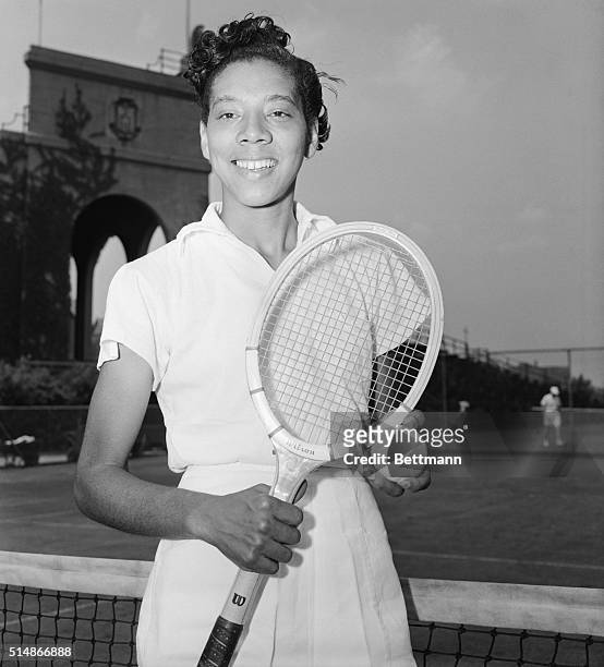 Althea Gibson poses with her tennis racket in the West Side Tennis Club in Forest Hills, New York. She is the first African American woman or man to...