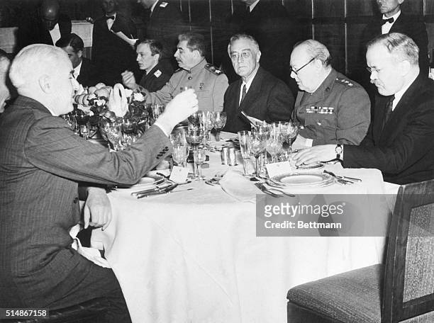 Marshal Josef Stalin, President Roosevelt, and Prime Minister Winston Churchill dining at Livadia Palace during the 1945 Yalta Conference.