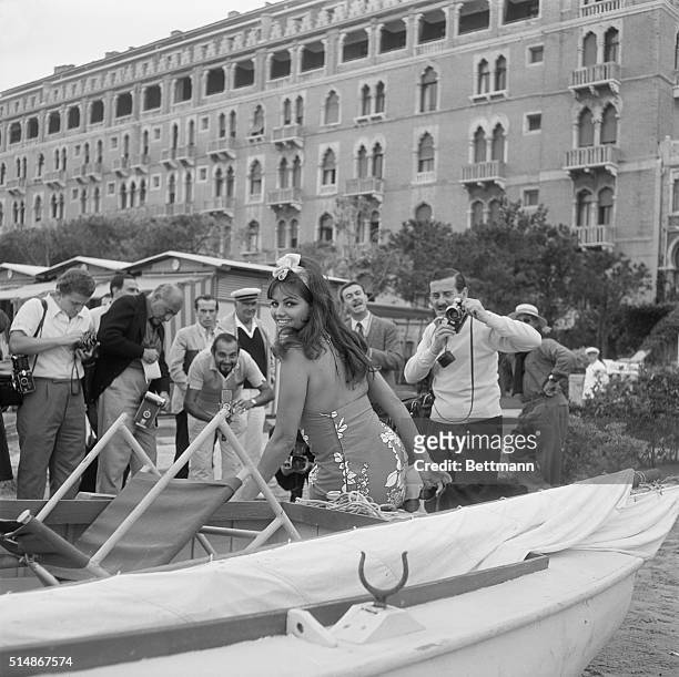 Venice,Italy: Brightening the recent film festival scene in Venice, actress Claudia Cardinale makes a perfect target for a battery of photographers....