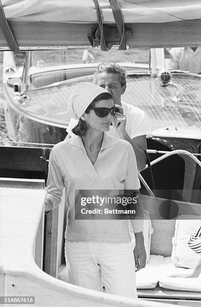 Jackie Kennedy is shown at the Pier of Amalfi, en route to Conca dei Marini beach via motorboat and then back from Amalfi to Ravello Villa.