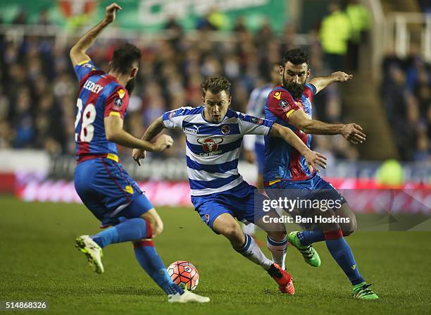 Simon Cox of Reading takes on Joe Ledley and Mile Jedinak of Crystal Palace during the Emirates FA Cup sixth round match between Reading and Crystal...