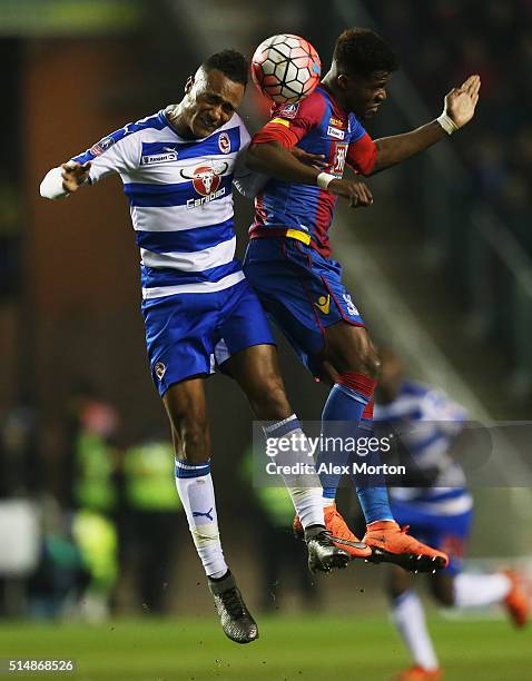 Jordan Obita of Reading and Wilfried Zaha of Crystal Palace jump for the ball during the Emirates FA Cup sixth round match between Reading and...