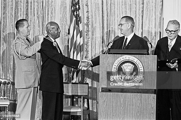 Wahington, DC: Still fighting at 80; The year is 1964 and President Johnson presents A. Philp Randolph with the presidential Medal of Freedom.