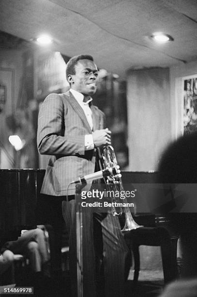 Los Angeles, California: Trumpeter Miles Davis shown performing at Shelley's Manne Hole nightclub.
