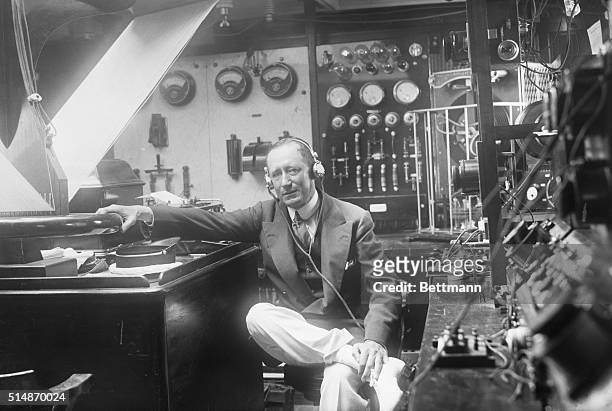 Guglielmo Marconi, in his radio room trying to listen in on planet Mars. BPA 2