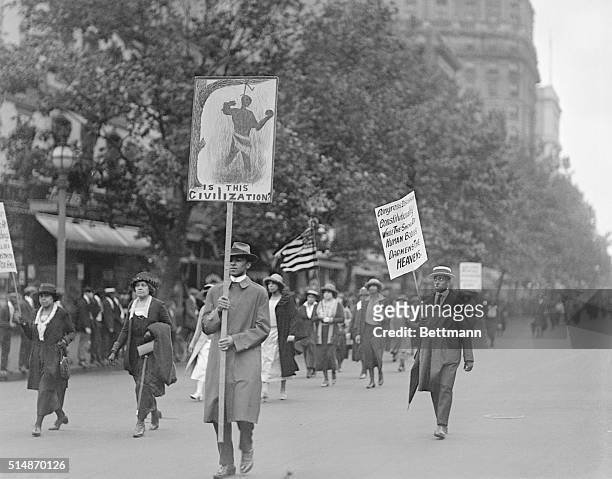 More than 3,000 African-American protesters marched on the streets of Washington carrying signs urging control and halting of the lynching of blacks....