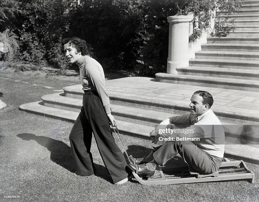 Grace Allen Pulling George Burns on Sled