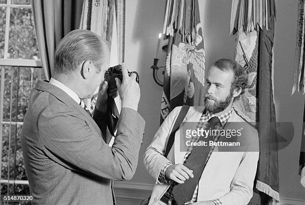 Washington, D.C.: After introducing his new personal photographer, David Hume Kennerly, at the White House, President Gerald Ford took Kennerly's...