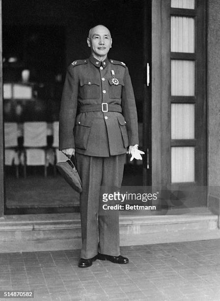 Full length photo of Chiang Kai-Shek in uniform.
